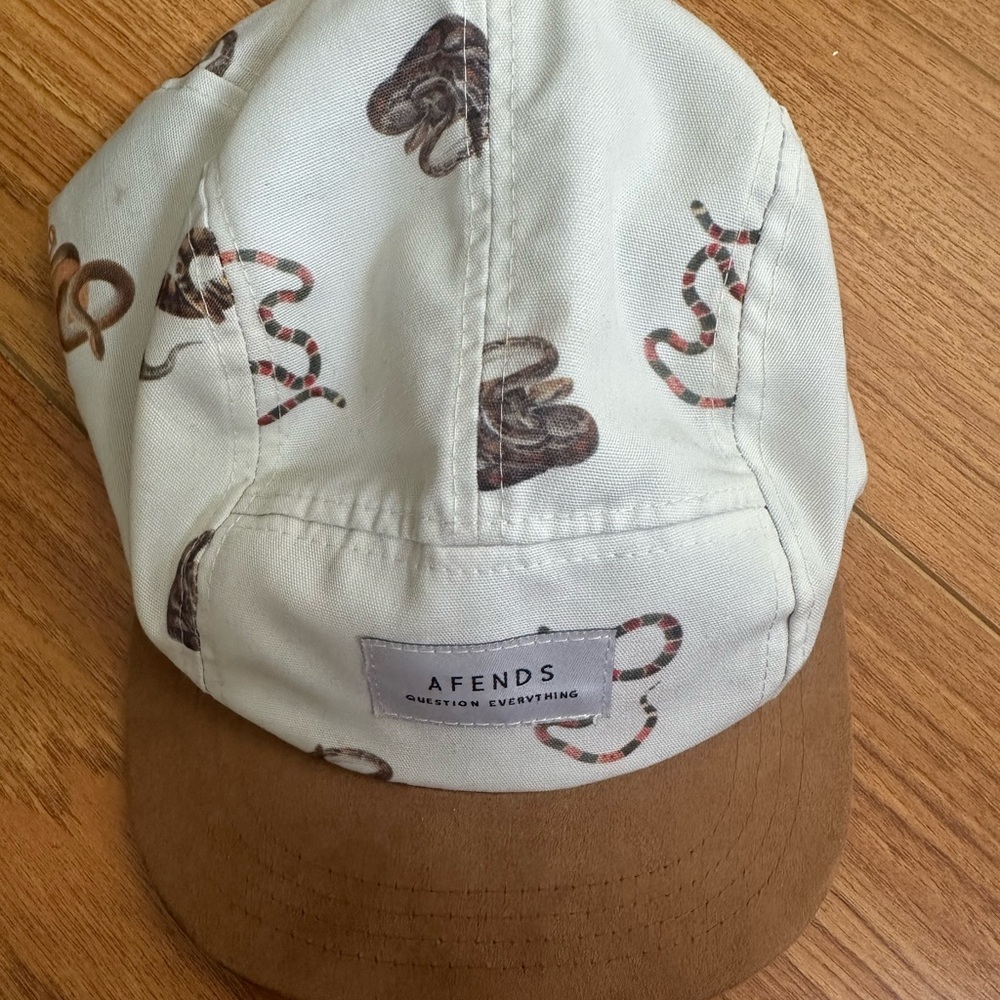 Backward hat with snakes